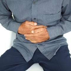 SEARCH will focus on three disease areas, including gastrointestinal conditions. Image by onstockphoto via Shutterstock. A man holding his hands against his stomach. Image by onstockphoto via Shutterstock.
