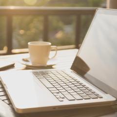A laptop on a table outdoors. IHI call topics for health research and innovation projects are online