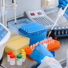 A scientist using a pipette. VIROMARKERS is studying viral infections HIV, hepatitis and CMV.