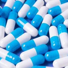 Blue and white pills. The project aims to improve clinical trials of new medicines.