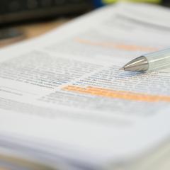 A pen on a scientific paper. Image credit: PolyPloiid