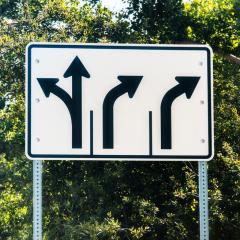 A road sign showing exit lanes. EXIT-CVD aims to help patients exit the cardiovascular disease continuum.