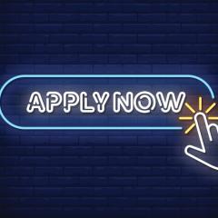 White neon lights say 'APPLY NOW' and a neon hand is clicking on this. THe background is dark blue tiles. 