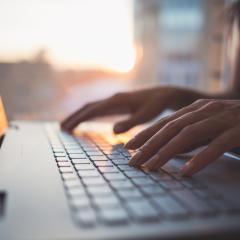 Woman typing. Image by Undrey via Shutterstock