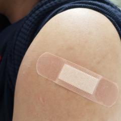 There were notable differences between countries regarding availibility and choice of vaccine brands. Image courtesy of Chanita Chokchaikul via Shutterstock Close-up of a band aid on the upper arm. Image courtesy of Chanita Chokchaikul via Shutterstock