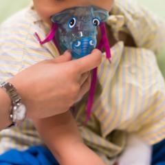 Child using medical mask. Image by Blanscape via Shutterstock