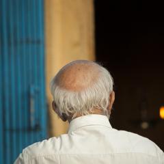 Old man from behind. Image by tiffgraphic shutterstock